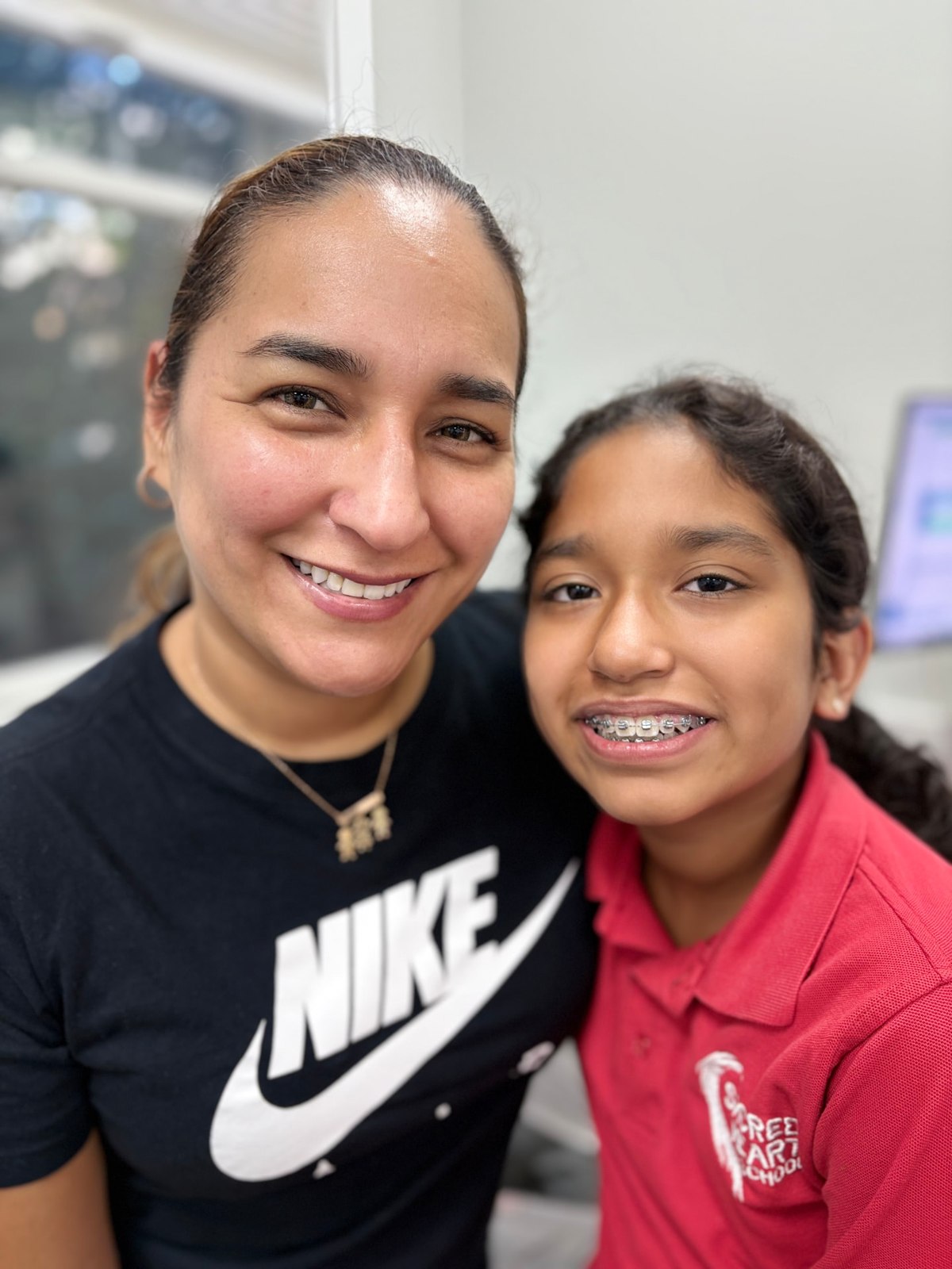 Family smiling together at NA Orthodontics